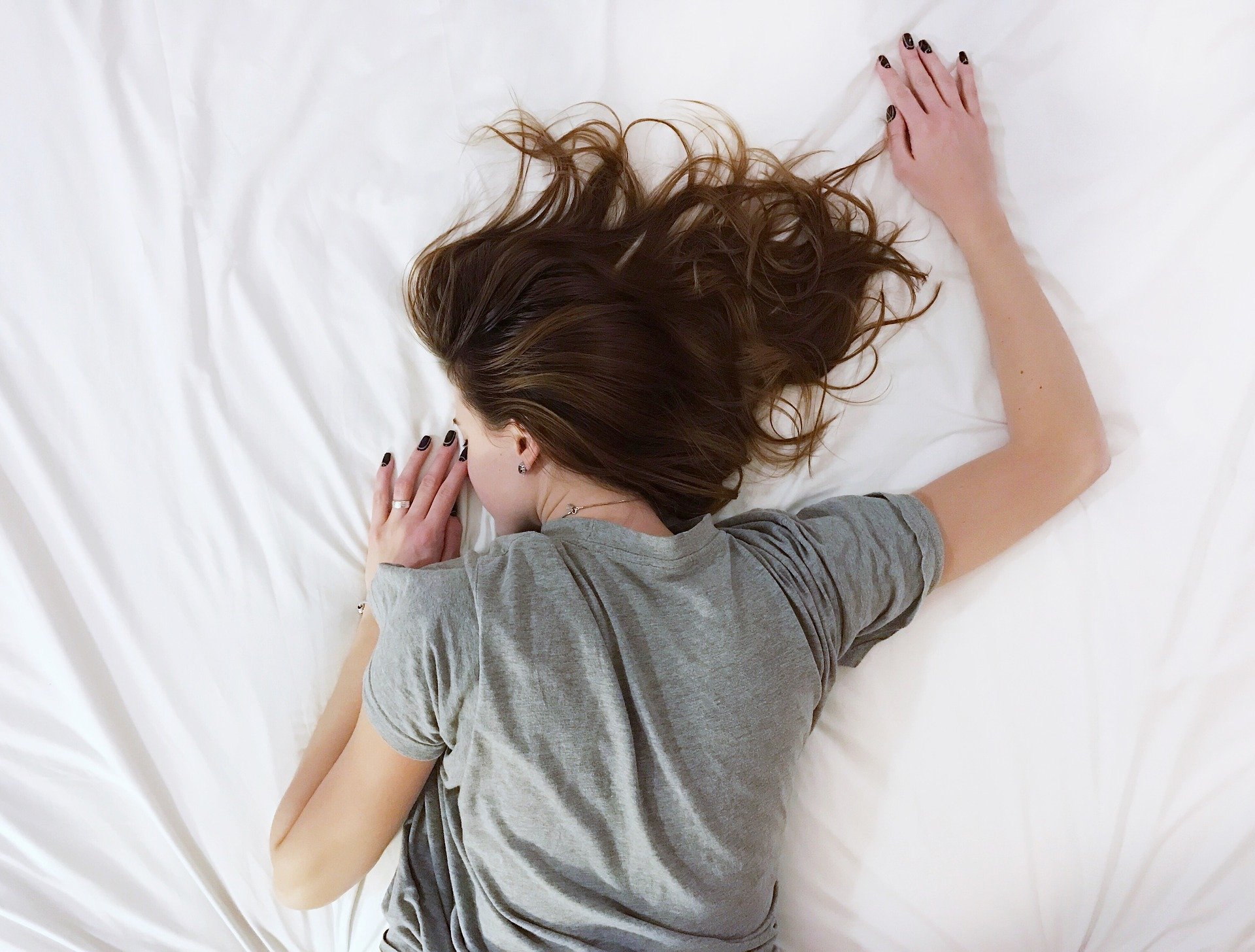 Woman face down on a bed